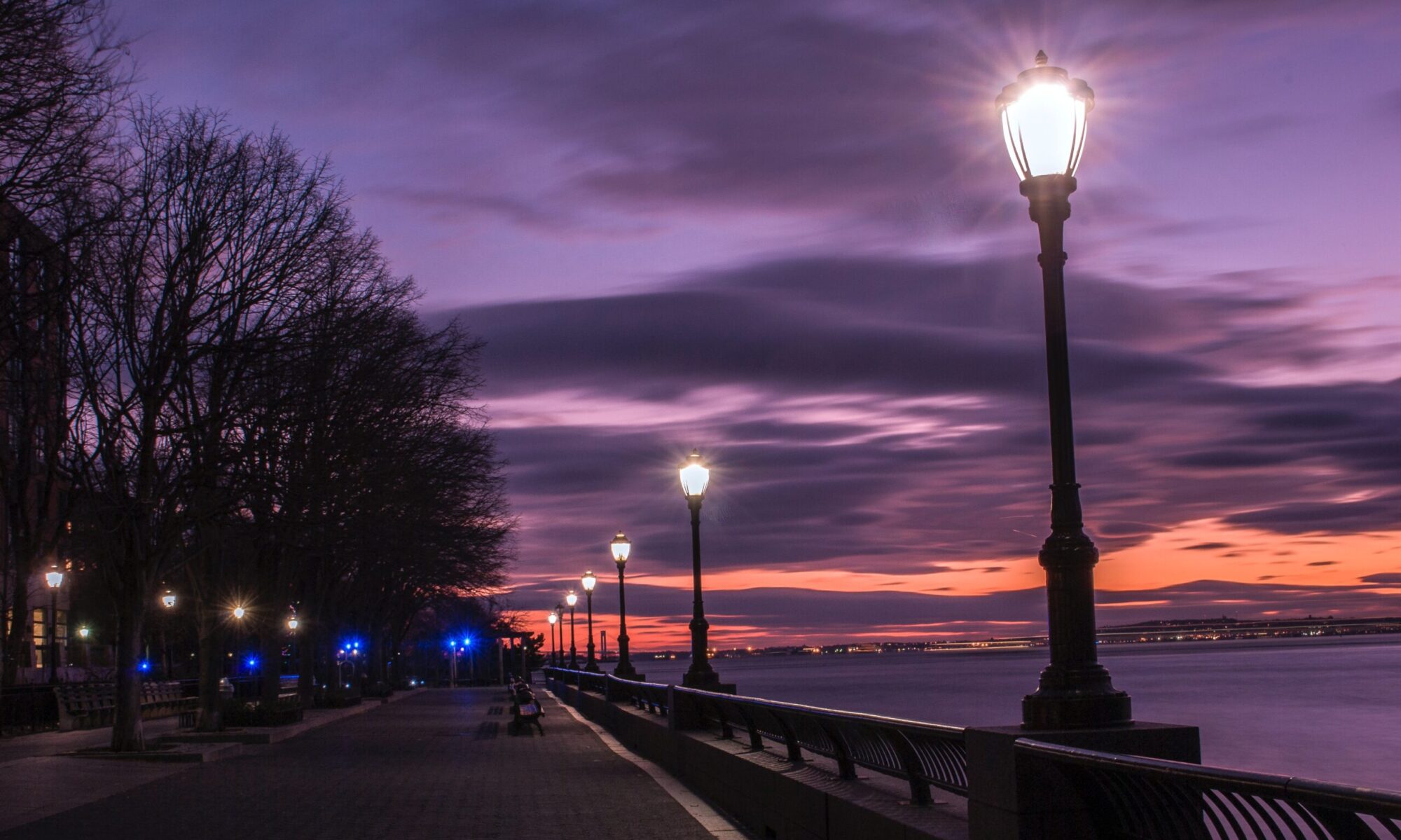 Lantern Light Design Co. header image, purple cloudy sky filled with lanterns.